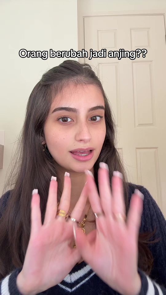 Video cover: Aisha talking to camera with her hands raised.